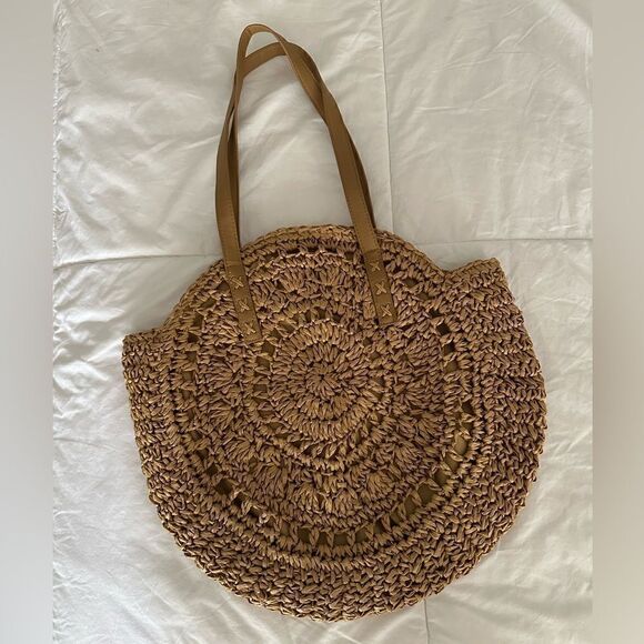 Handbags - Tan woven round beach bag